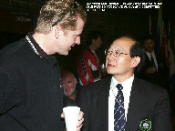 NKA Olympic Delegate Dr. Chee Ling in conversation with Olympic Medalist Curt Harnett.