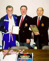 Ron Tkacz (Tournament Director) and Murayama sensei ( Chief Referee Council) receiving Appreciation Awards from Sensei Sam Moledzki.