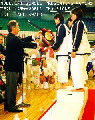 Moledzki sensei presenting Women's Team Kata World Champions award.