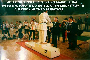 Moledzki sensei presenting award to Open Weight Kumite Champion, Alonso Murayama.