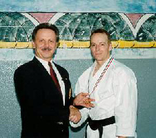 Moledzki sensei congratulating his student Mike Zinck, Bronze medal winner (Kumite division).