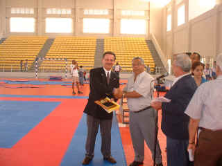 NKA Canada Delegate sensei Moledzki accepts plaque from Dominican Republic Rep.