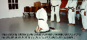 Westmore Smith (Shito-kai Toronto Honbu Dojo) puts on his new black belt after passing his grading.